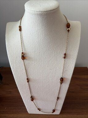 Vintage Long Station Gold Tone Necklace with Faceted Amber colored Beads.